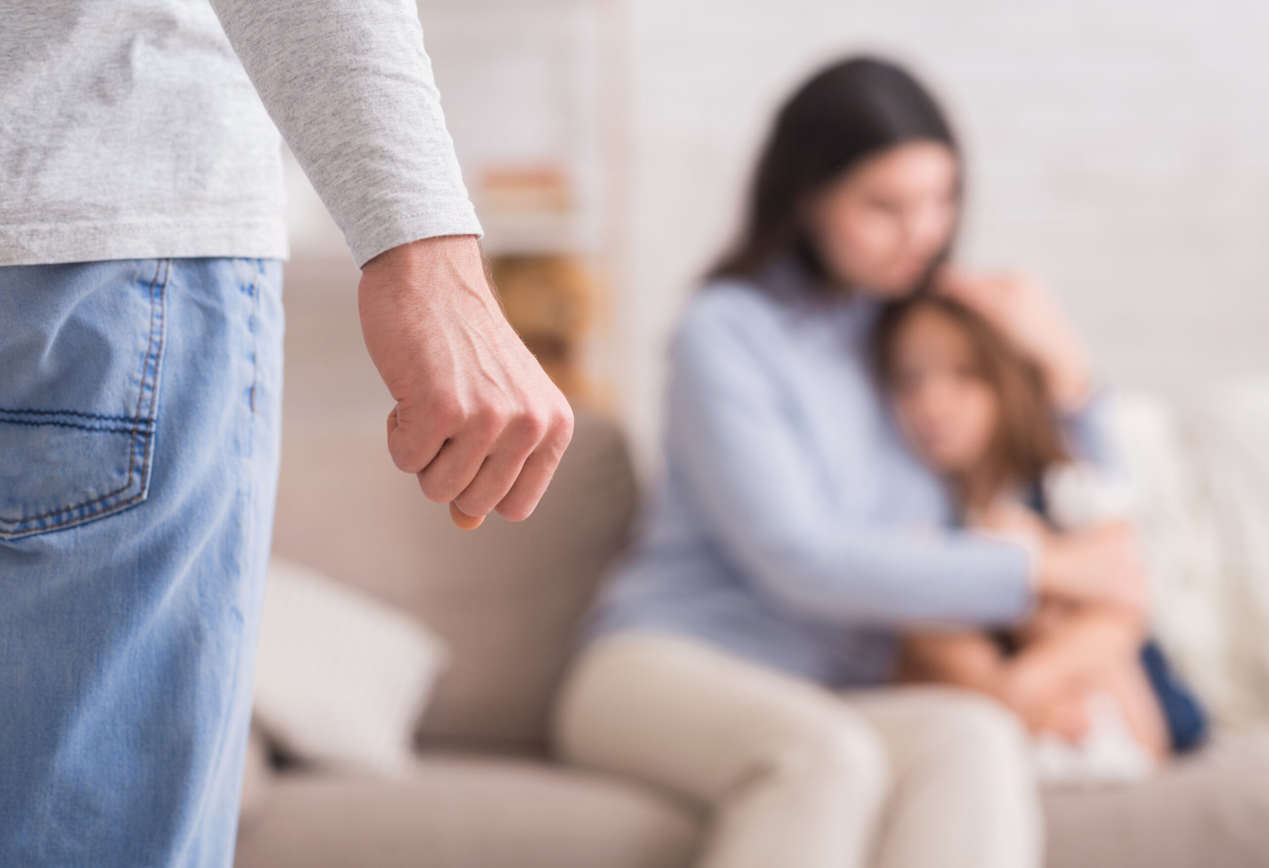 man with clenched fist implying domestic abuse